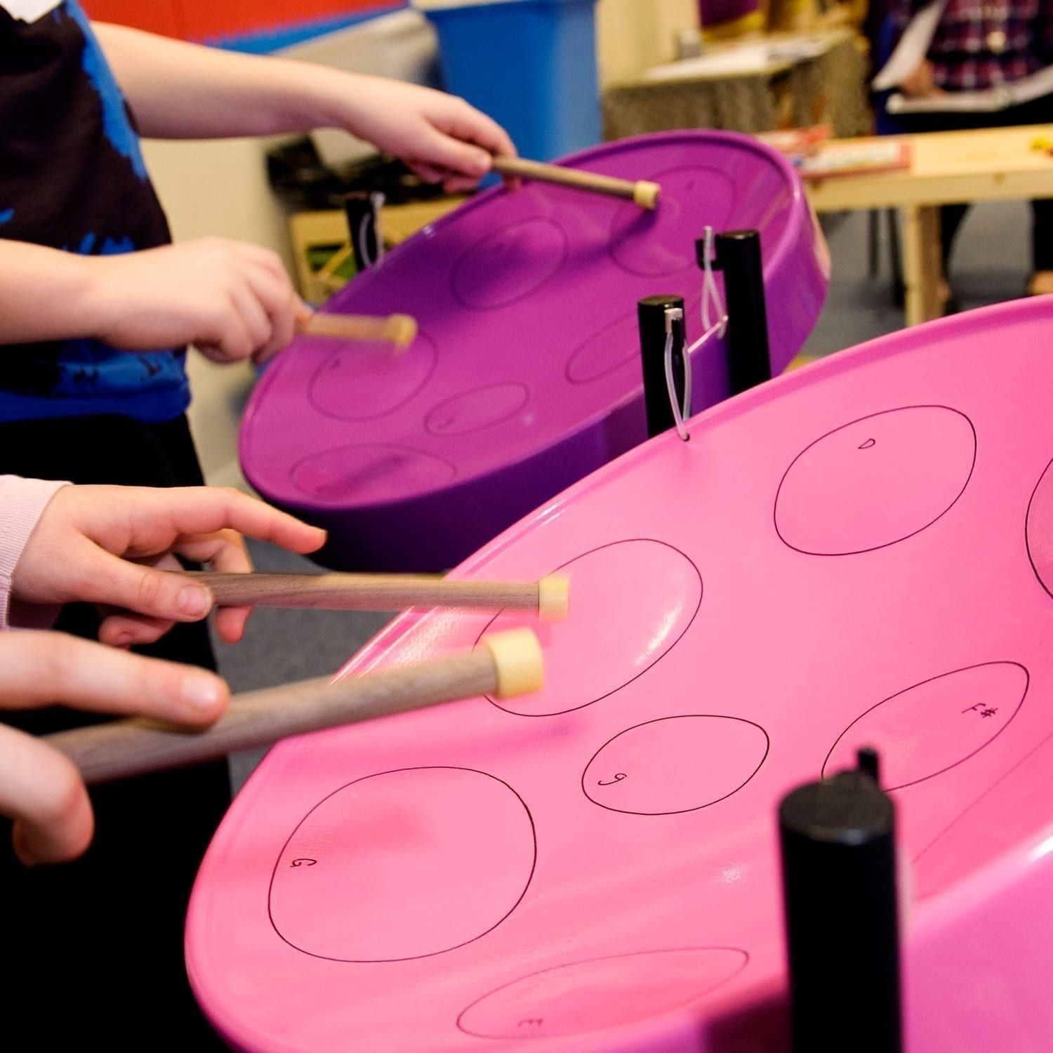 Image of Primary students playing Drums for School's Caribbean Steel Pan