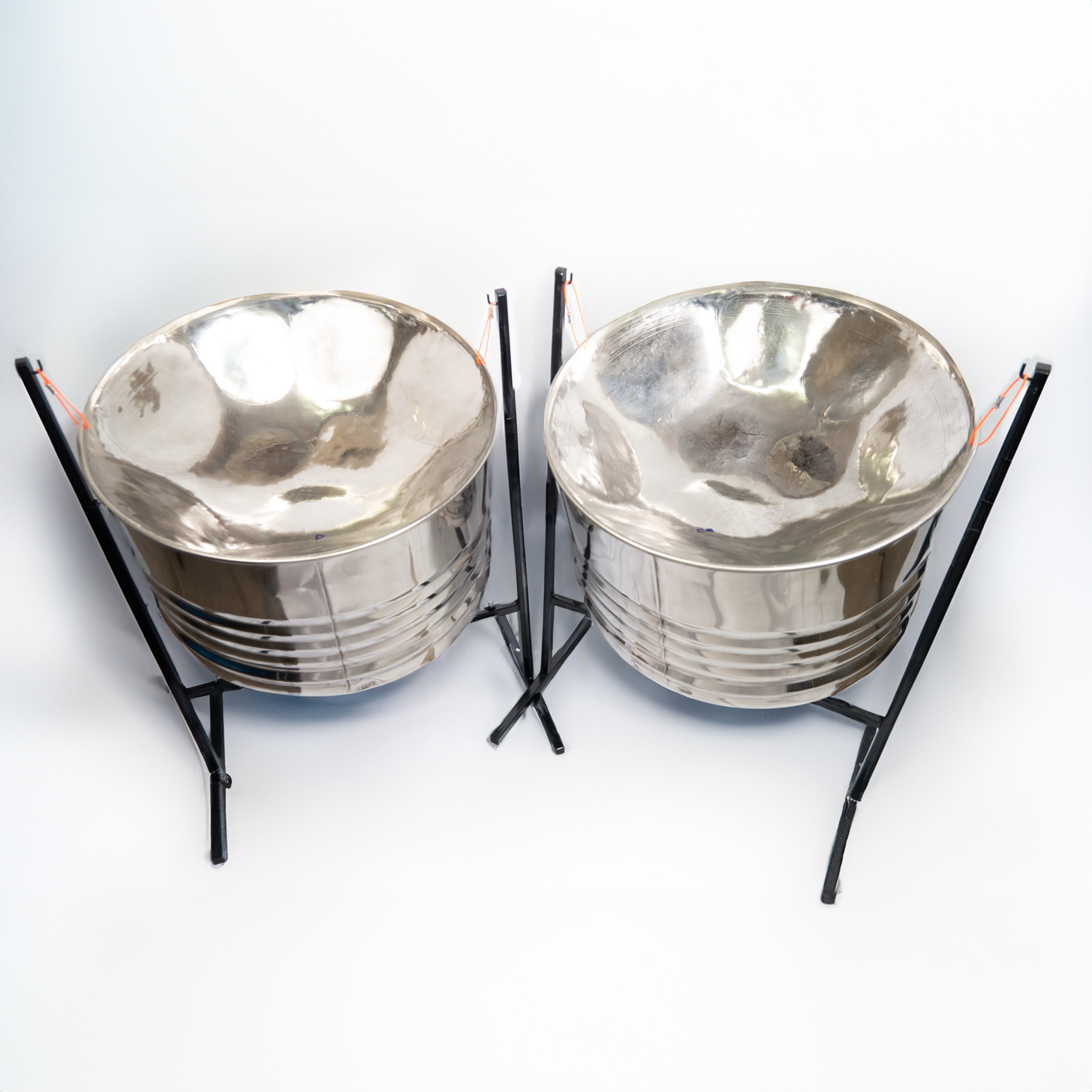 Chrome double guitar steel pan set with stands and mallets, ideal for vibrant Caribbean rhythms and professional performances.